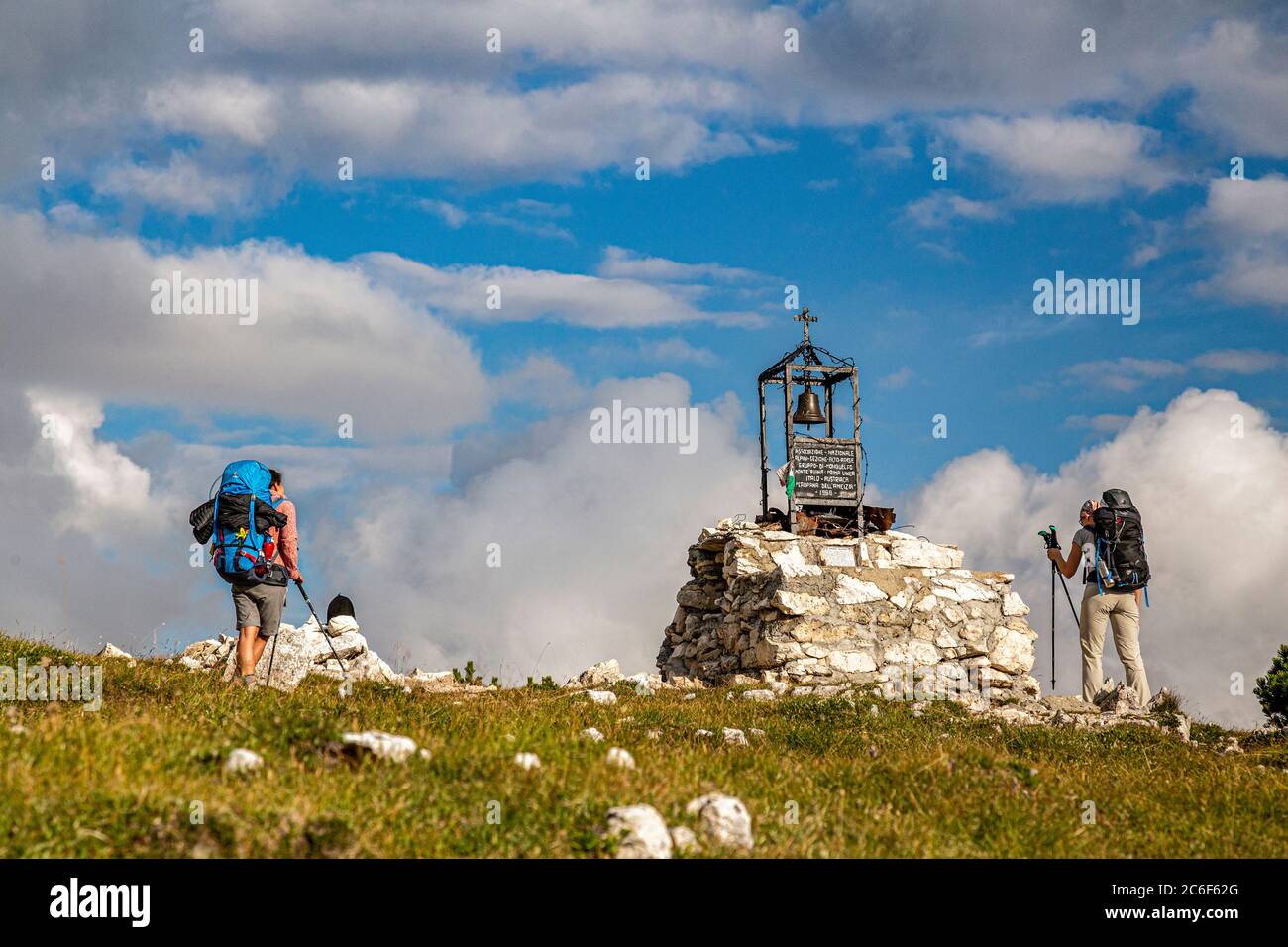 Italy South Tyrol  Alta Pusteria Dobbiaco Monte Piana -  Hikers near the Peace Bell on Monte Piana Stock Photo