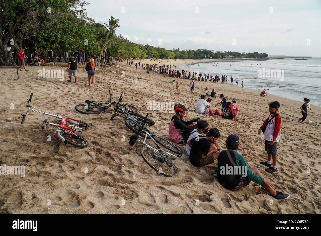Badung Bali Indonesia 9th July 2020 A Group Of Cyclists Lays Their Bicycles Down The Beach