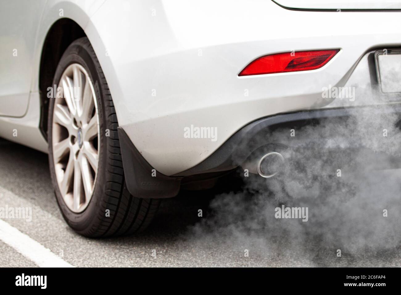 Exhaust pipe of a car blowing out the pollution from the back of a