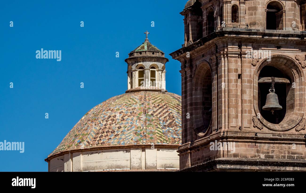 Bell tower and dome with mosaic of Church of the Society of Jesus in Cusco Peru. Stock Photo