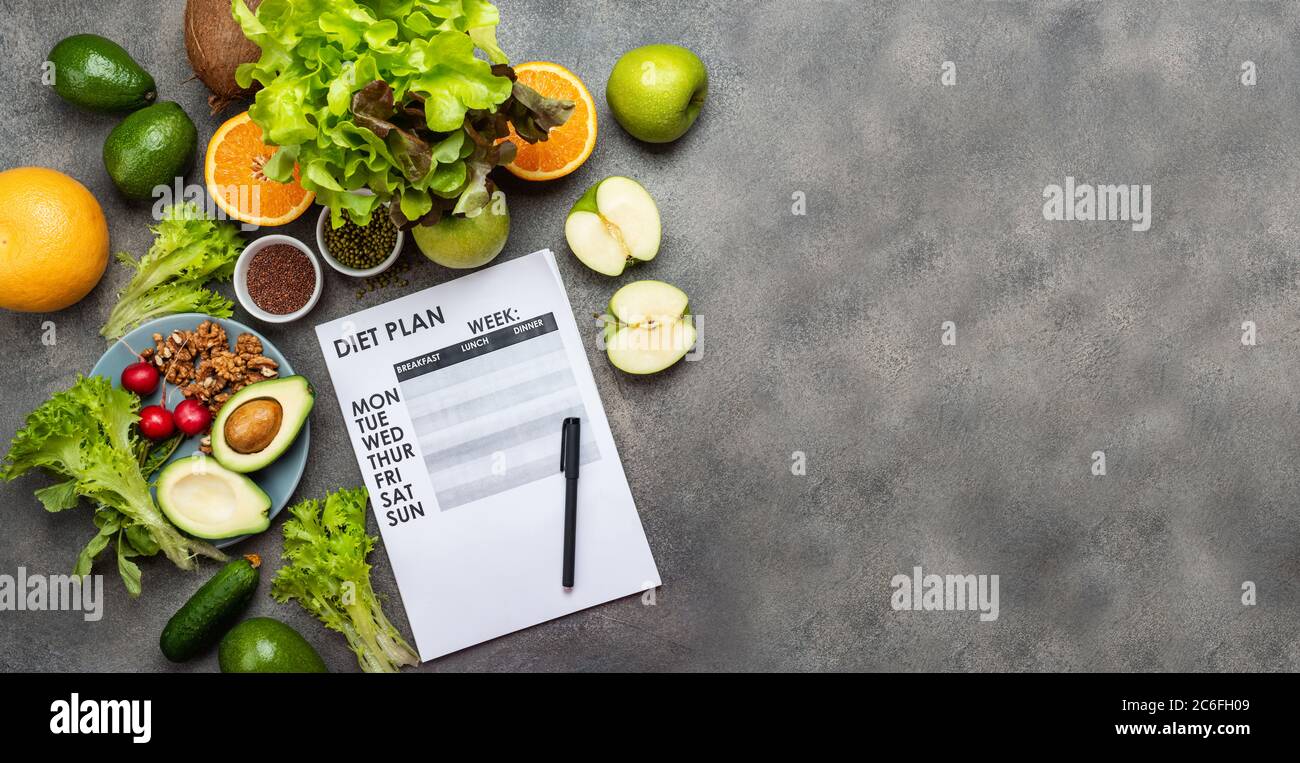Diet meal plan concept. Fresh vegetables and weight loss program on the sheet. Copy space top view. Stock Photo