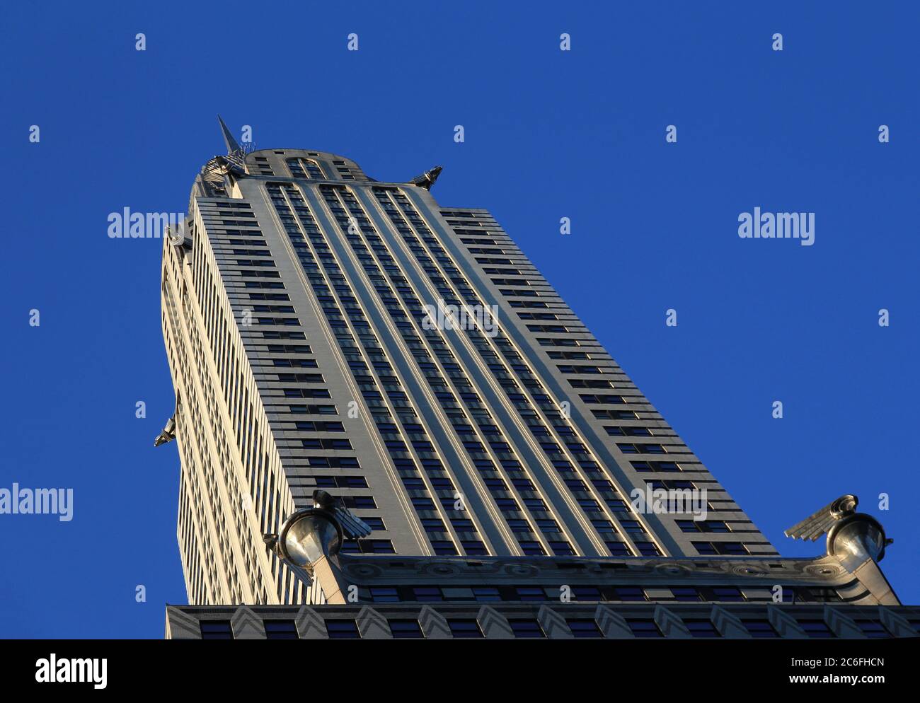The iconic art deco Chrysler building set against the brilliant blue sky Stock Photo