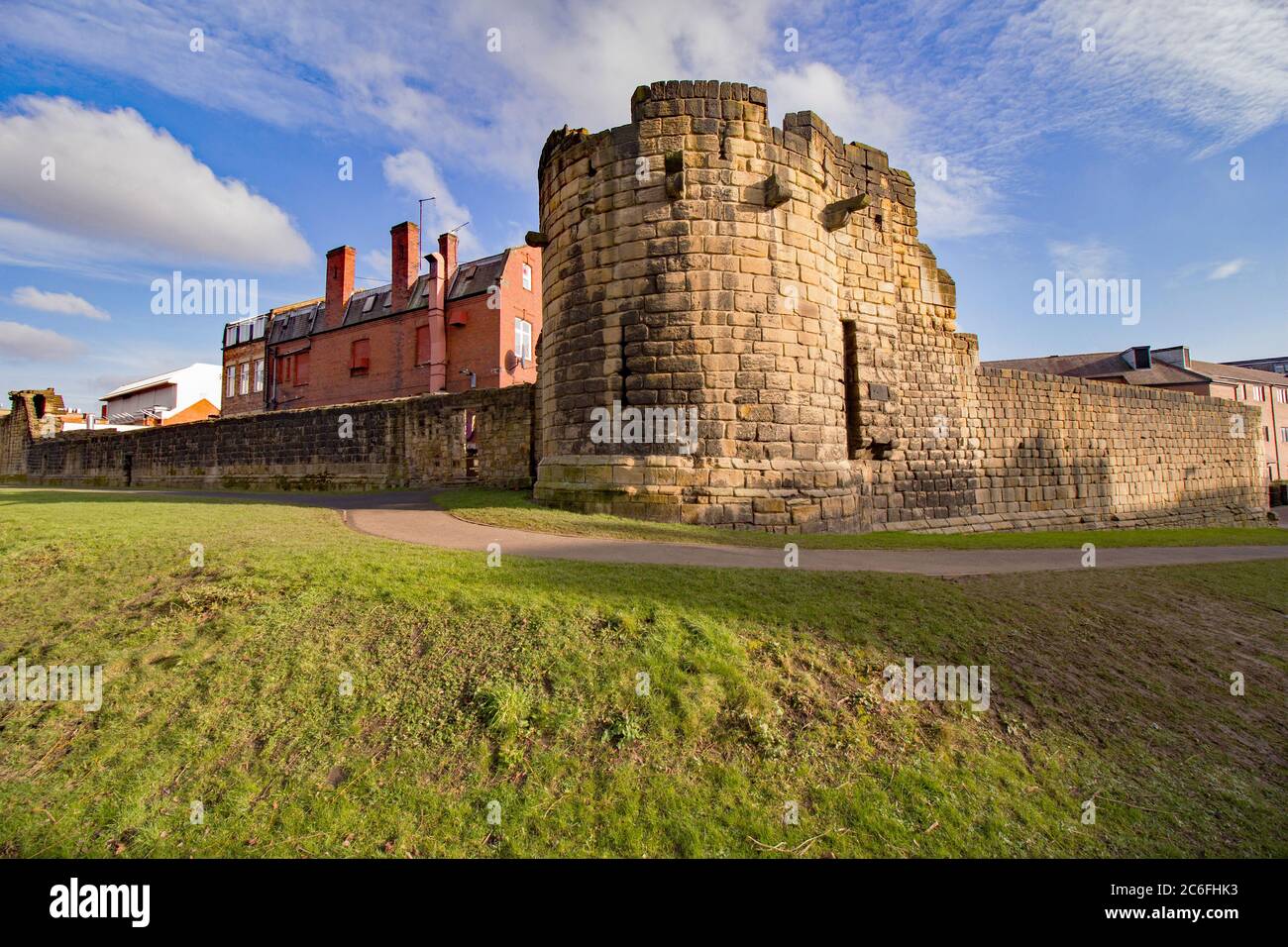 Newcastle Upon Tyne’s medieval castle walls that surround the city and image is taken from the moat on the outer side Stock Photo