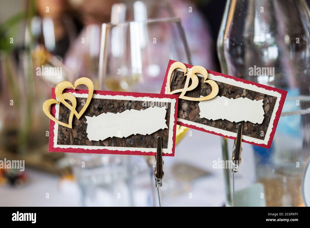 Name plates with double hearts decoration on dinner table for ...