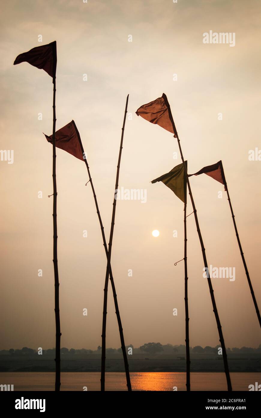 Hindu Prayer flags near the Ganges River at sunset, Varanasi, India Stock Photo