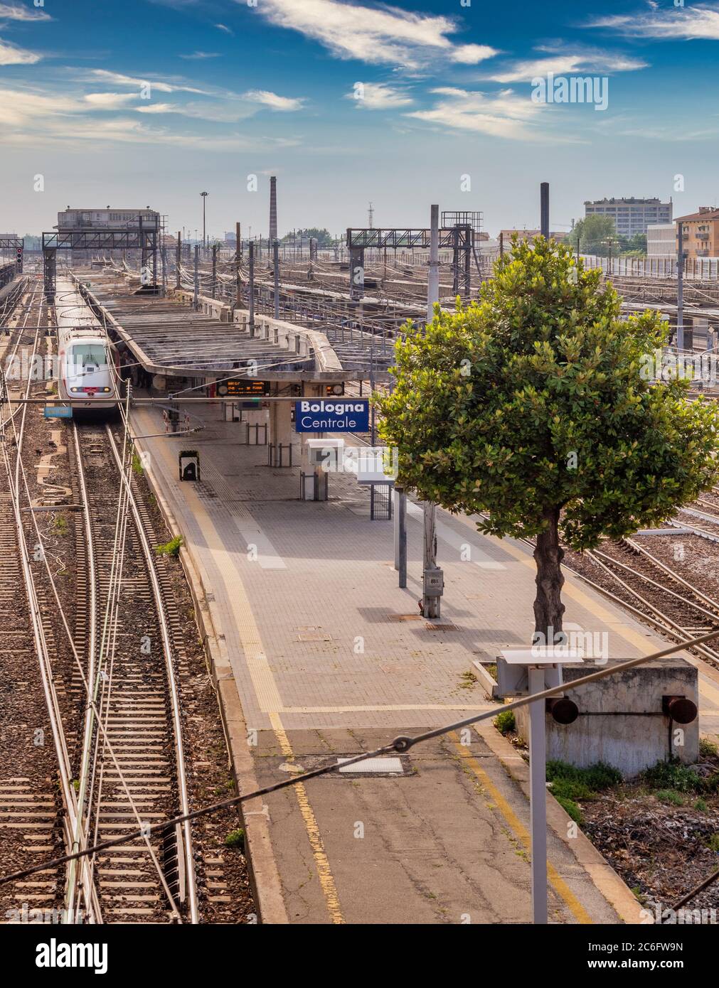 Train pulling into  Bologna Centrale railway station, seen from Via Giacomo Matteotti. Italy. Stock Photo