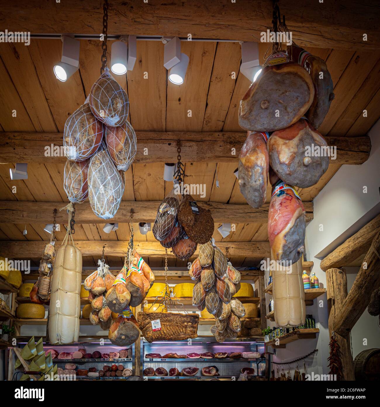 Hams hanging from a Salumeria roof. Bologna. Italy. Stock Photo