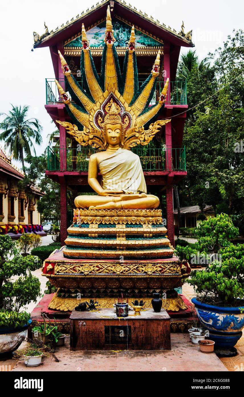 Golden Buddhist statue in Vientiane, Laos, Southeast Asia Stock Photo