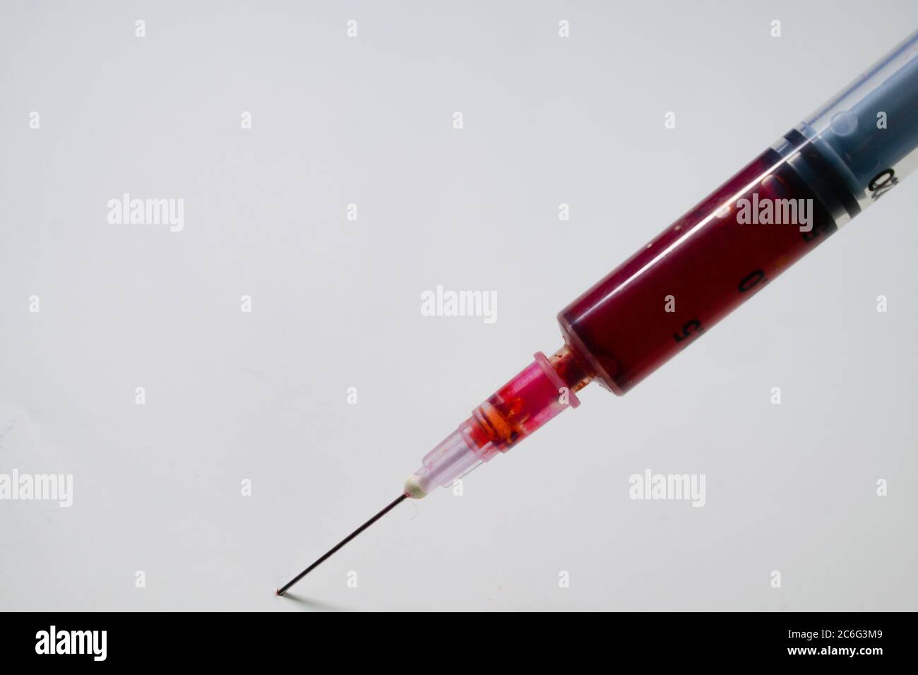 Injection containg blood sample for testing isolated in laboratory