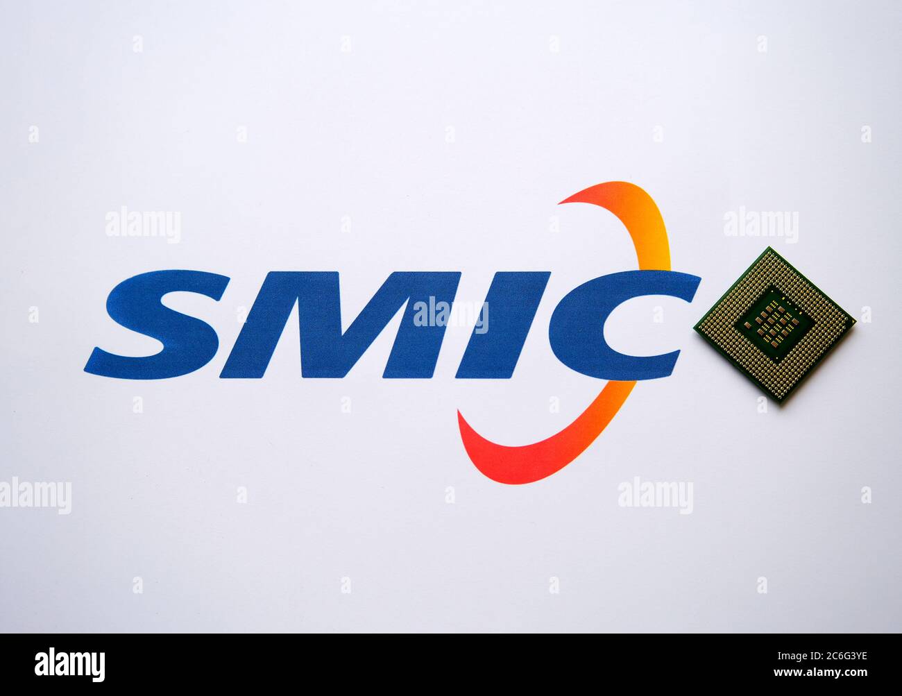 Stone / United Kingdom - July 9 2020: SMIC (Semiconductor Manufacturing International Corporation) logo on the printed document and large computer chi Stock Photo