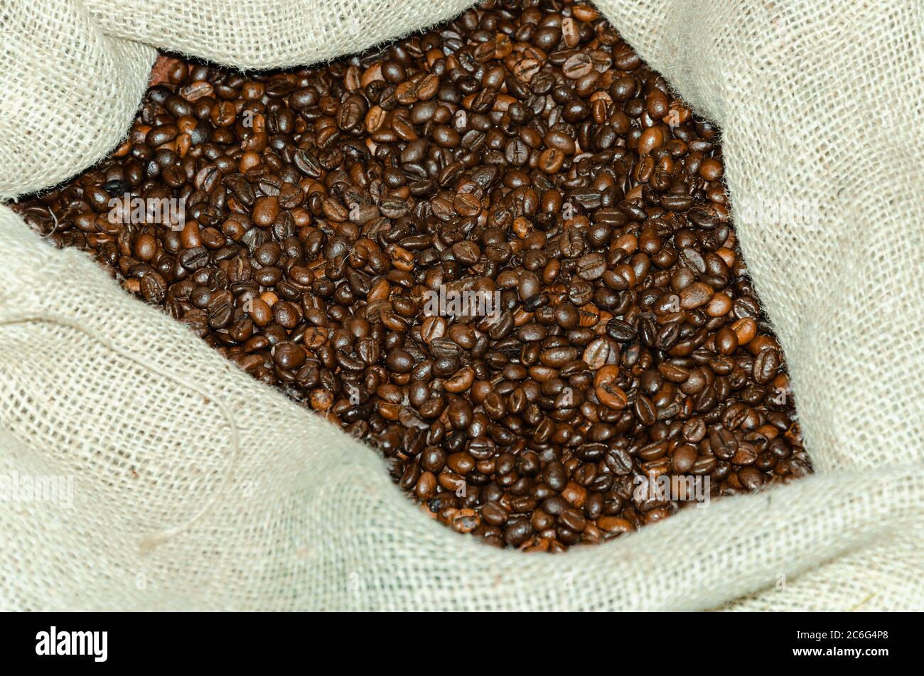 coffee beans, brown in burlap from natural threads, close-up Stock Photo