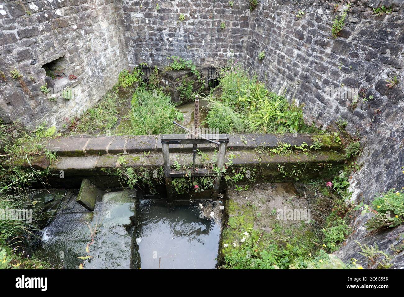 Historic water control structure at Cromford in the Derwent Valley known as The Bear Pit Stock Photo
