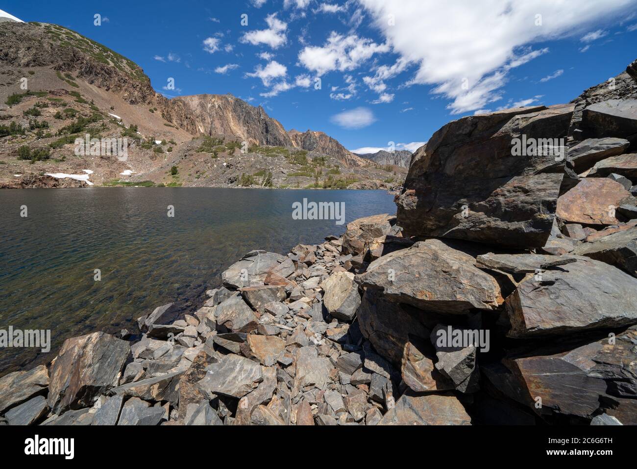 Large rocks and loose scree along Lake Helen along the 20 Lakes Basin ...