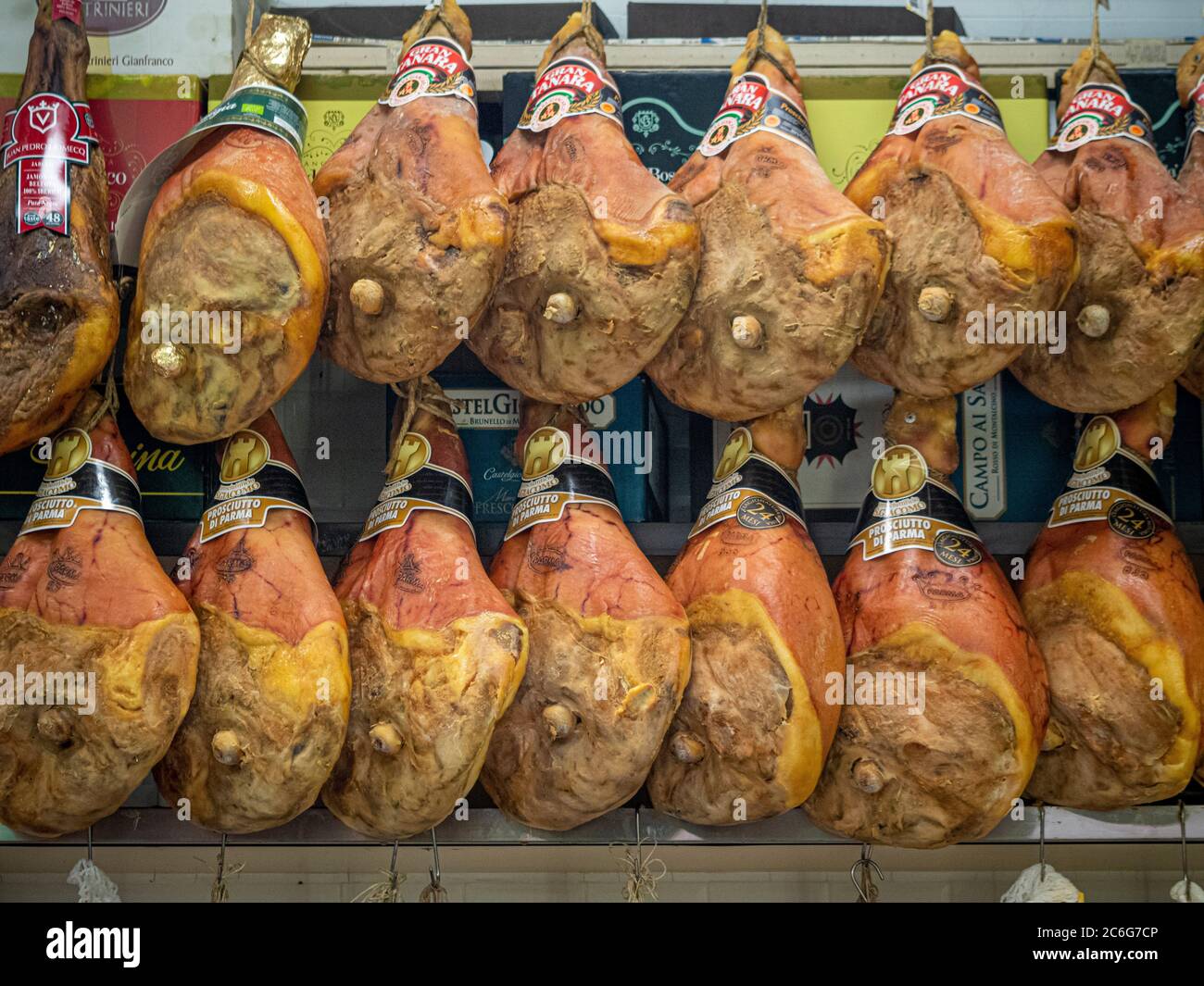 Parma hams hanging in Mercato Albinelli, Modena, Italy. Stock Photo