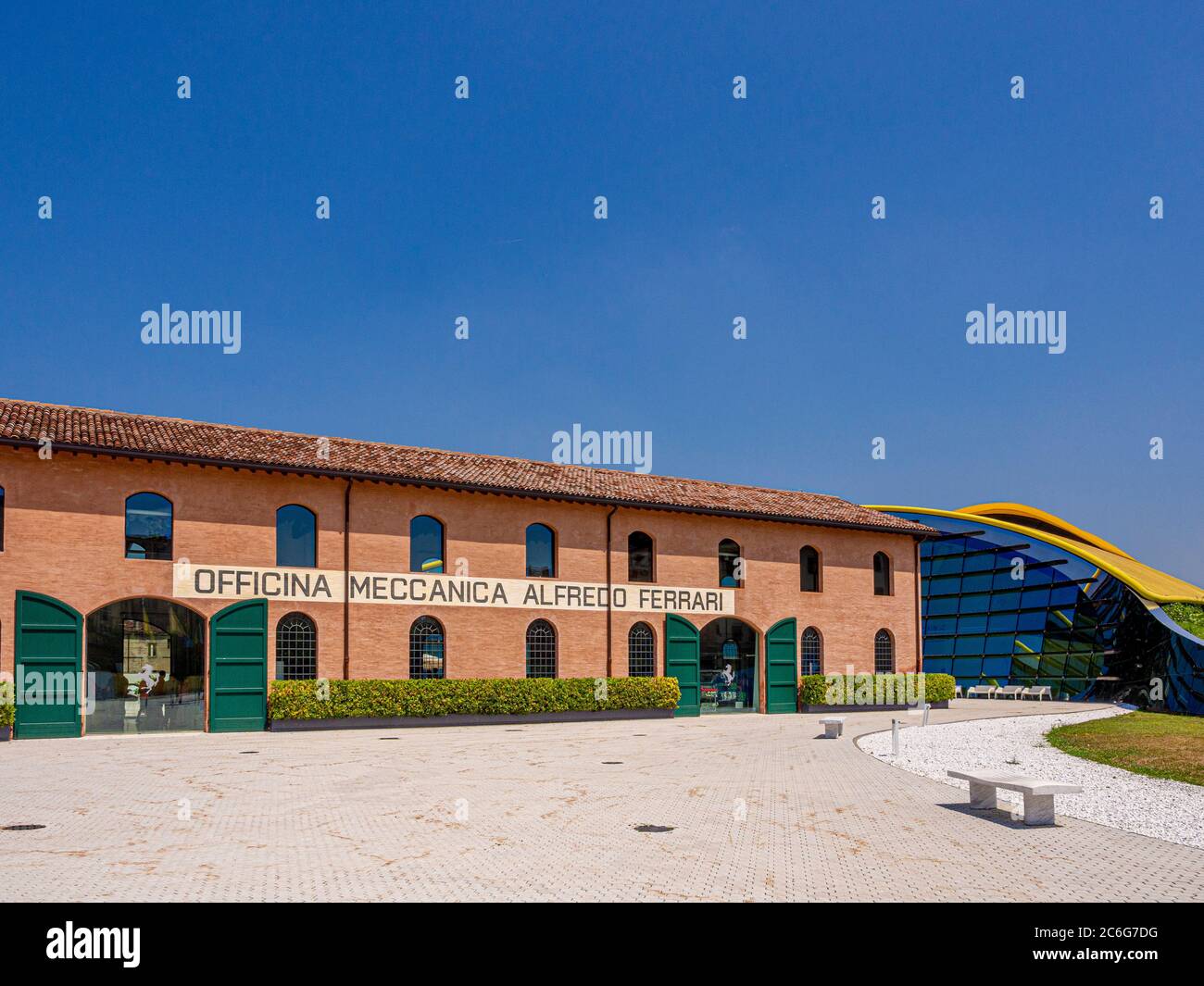 Exterior of the original workshop next to the contemporary visitor's centre at the Enzo Ferrari Museum. Modena, Italy. Stock Photo