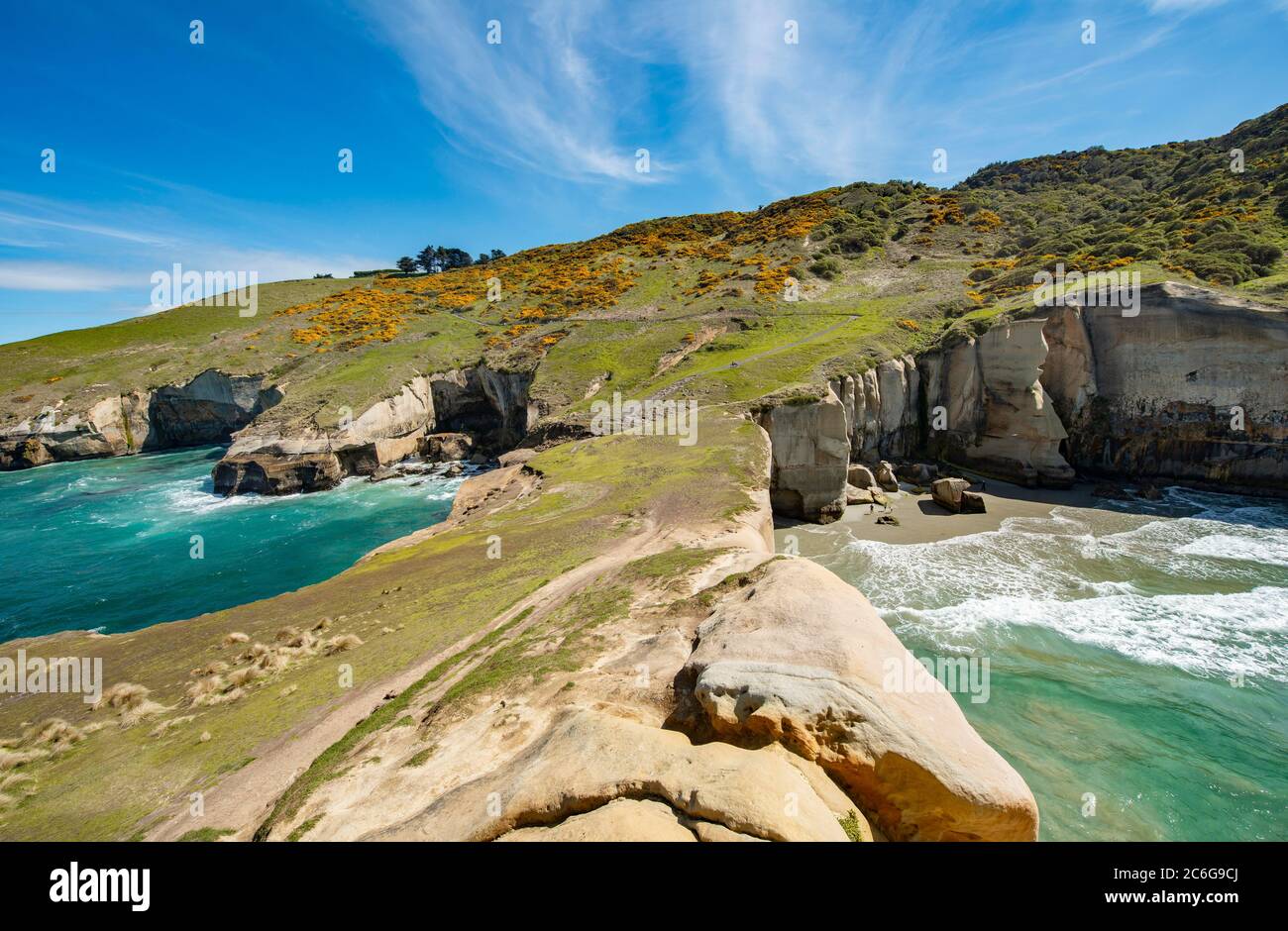 Rocky cliffs of sandstone rocks, Tunnel Beach, Otago, South Island, New Zealand Stock Photo Alamy
