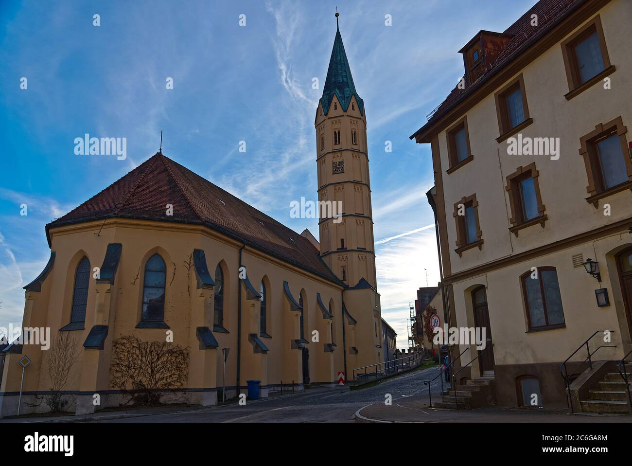 Yellow Hospital Church St. Alban in Lauingen is a Gothic Building, wich i have visited at a Sunny Winter Day, Bavaria, Germany, Travel, Europe Stock Photo