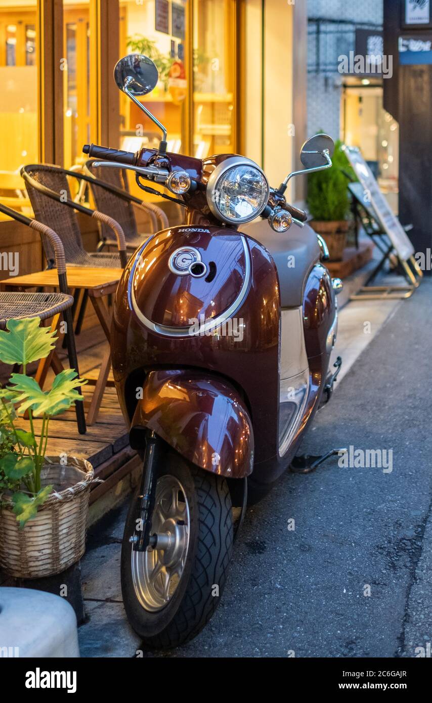 Vespa scooter in the street sidewalk of Shimokitazawa neighborhorhood, Tokyo, Japanp Stock Photo