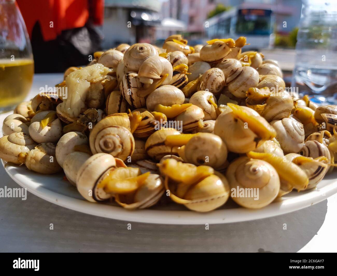Plate with small cooked snails. A Typical portuguese appetizer Stock Photo
