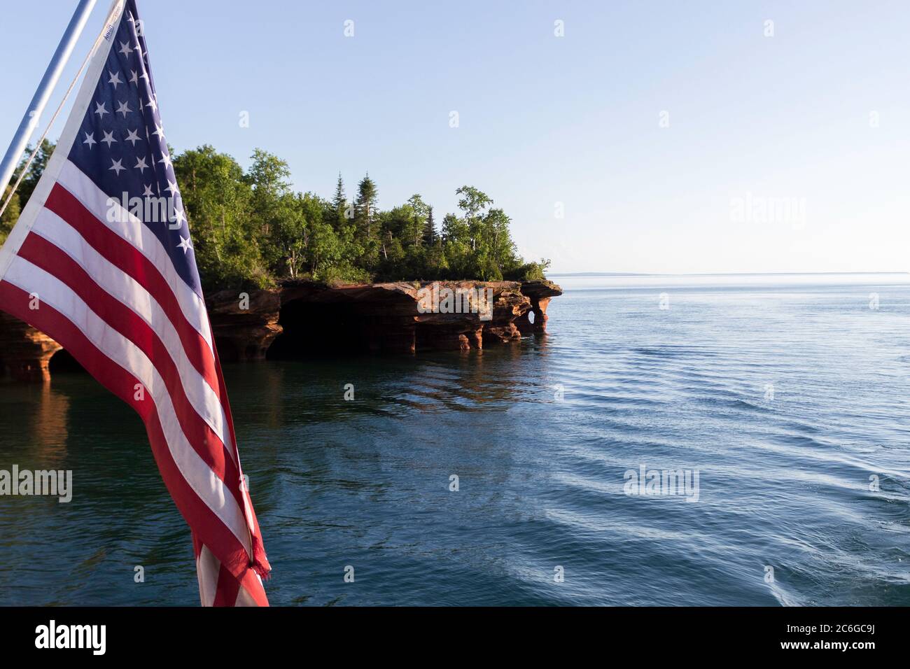 American Flag Waving in the Wind While on the Water Stock Photo