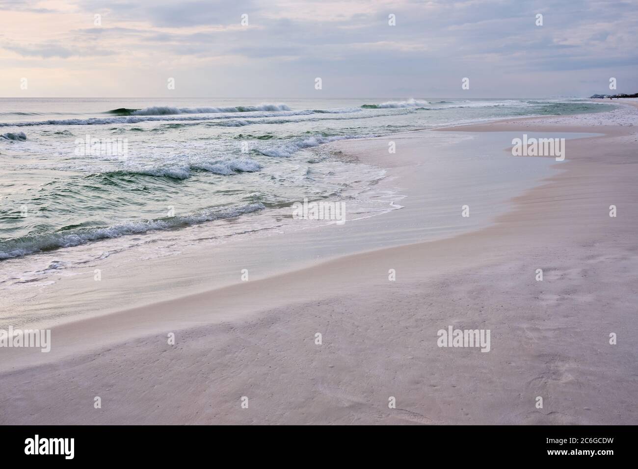 Emerald waters of the Gulf of Mexico meet white sand of Destin, Florida creating a tranquil seascape in pastel tones. Stock Photo