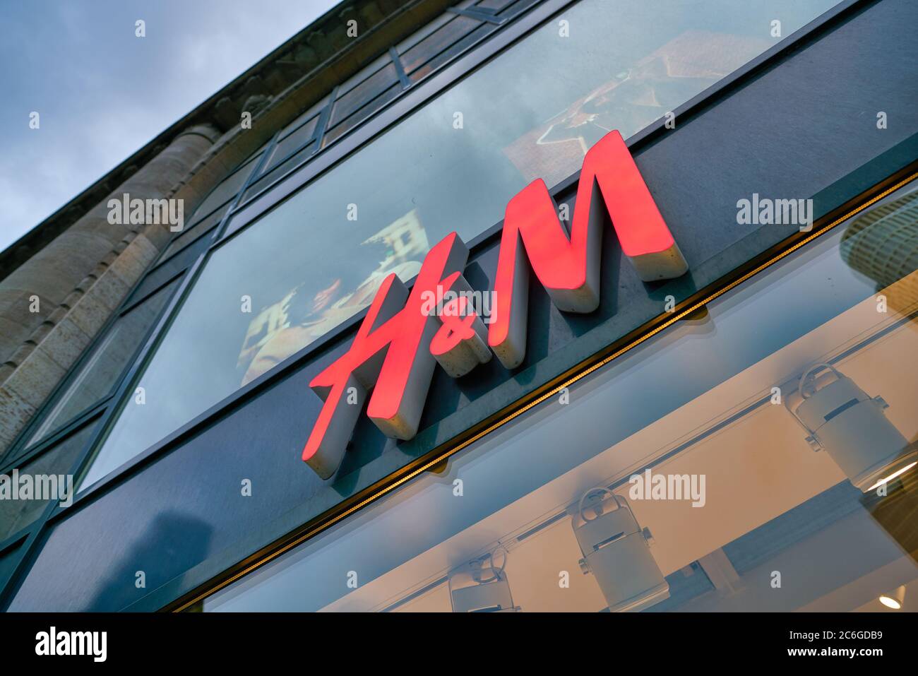 BERLIN, GERMANY - CIRCA SEPTEMBER, 2019: close up shot of H & M storefront as seen from a street in Berlin. Stock Photo