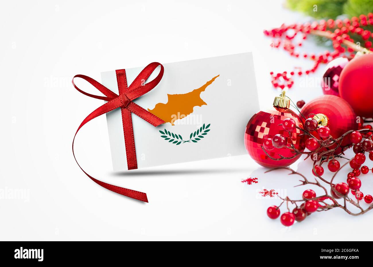 Cyprus flag on new year invitation card with red christmas ornaments concept. National happy new year composition. Stock Photo