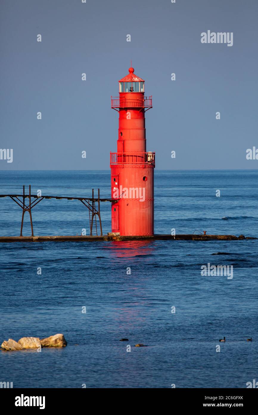 Algoma Pierhead Lighthouse in Algoma, Wisconsin in the summer with a blue sky, vertical Stock Photo
