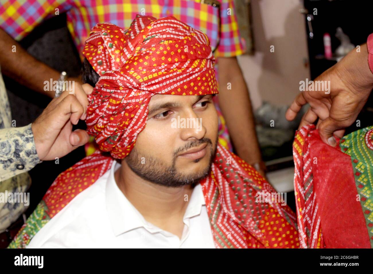 Asian man wearing turban with traditional style in indian hindu culture, Indian groom in colorful dress, selective focus with blur. Stock Photo