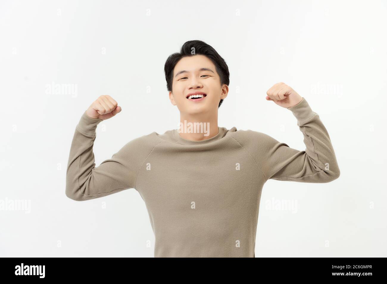A portrait of happy excited young Asian man isolated on white ...