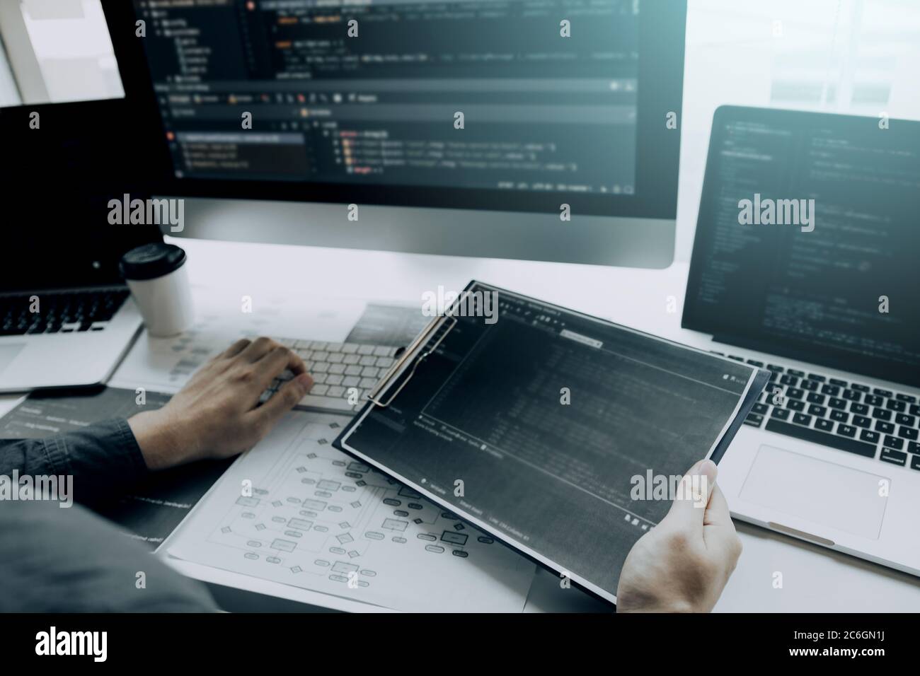 Asian man working code program developer computer web development working design software on desk in office. Stock Photo