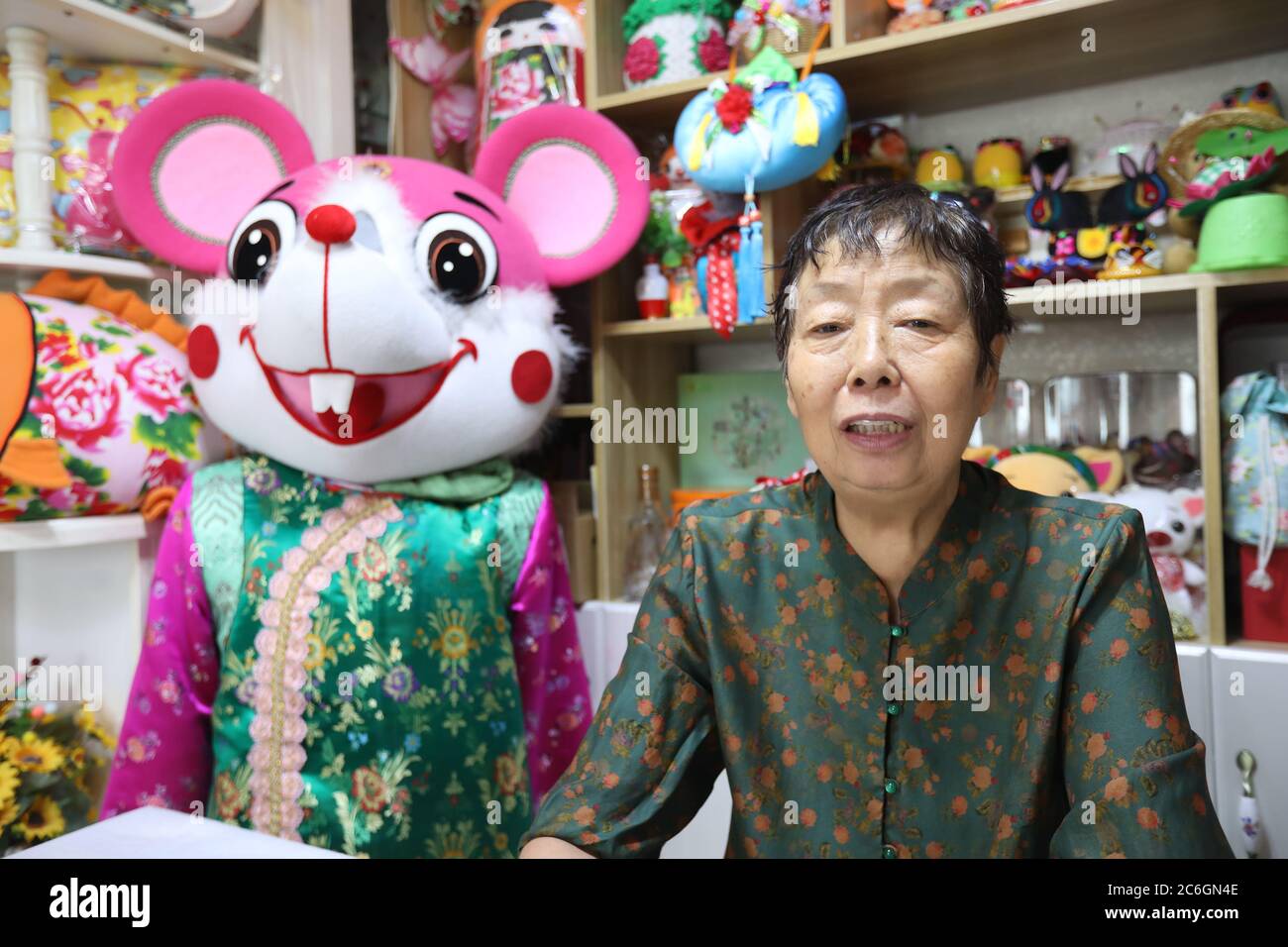 Ms. Wei shows one of her sewing piece at her living room in Xi'an city, northwest China's Shaanxi province, 18 June 2020. 70-year-old Ms. Wei gained p Stock Photo
