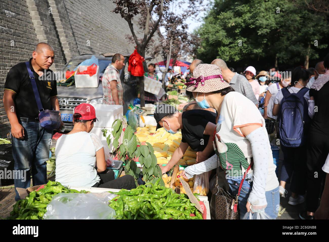 The Bustling Morning Street Of Xiaonanmen Is Crowded With People Street Vendors Set Up Mobile 
