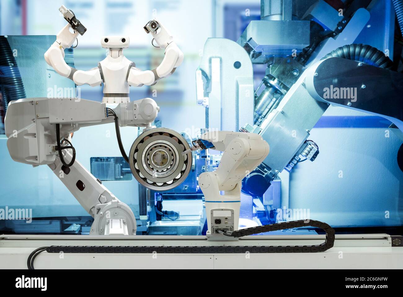 Industrial robotic gripping and smart robot working on smart factory, industry 4.0 and technology concept Stock Photo