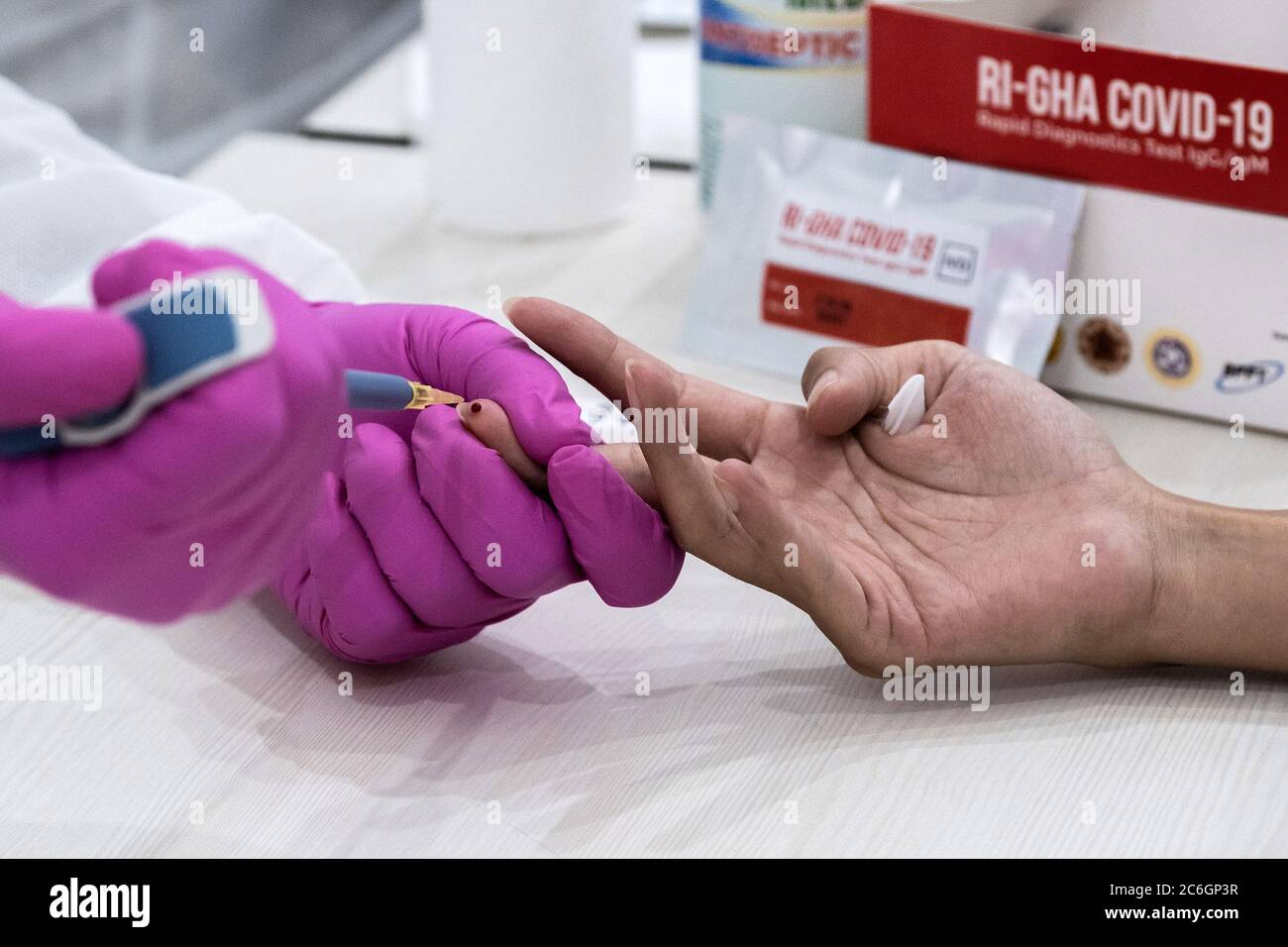 Jakarta, Indonesia. 09th July, 2020. Medical workers take blood samples from government employees during the Coronavirus test using RI-GHA COVID-19 rapid test in Jakarta, indonesia, on July 9, 2020. The rapid test was to detect early Coronavirus (COVID-19) infections in government employees in order to prevent the spread. The test was also to mark a new normal order by implementing strict health protocols. (Photo by Evan Praditya/INA Photo Agency/Sipa USA) Credit: Sipa USA/Alamy Live News Stock Photo