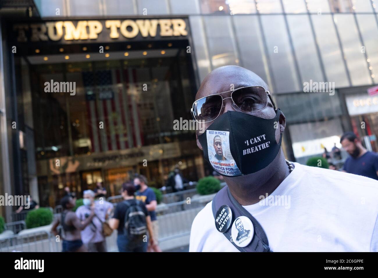 New York, United States. 08th July, 2020. A man wears a face mask with a portrait of George Floyd and the message 'I can't breath' in front of Trump Tower where a large Black Lives Matter mural was painted.As New York City enters phase 3 of reopening retail stores for indoor shopping, restaurants have been postponed for indoor dinning. Meanwhile Black Lives Matter protests continue in the city as the Mayor along with a group of people painted a large Black Lives Matter mural in front of Trump Tower on 5th Ave. Credit: SOPA Images Limited/Alamy Live News Stock Photo