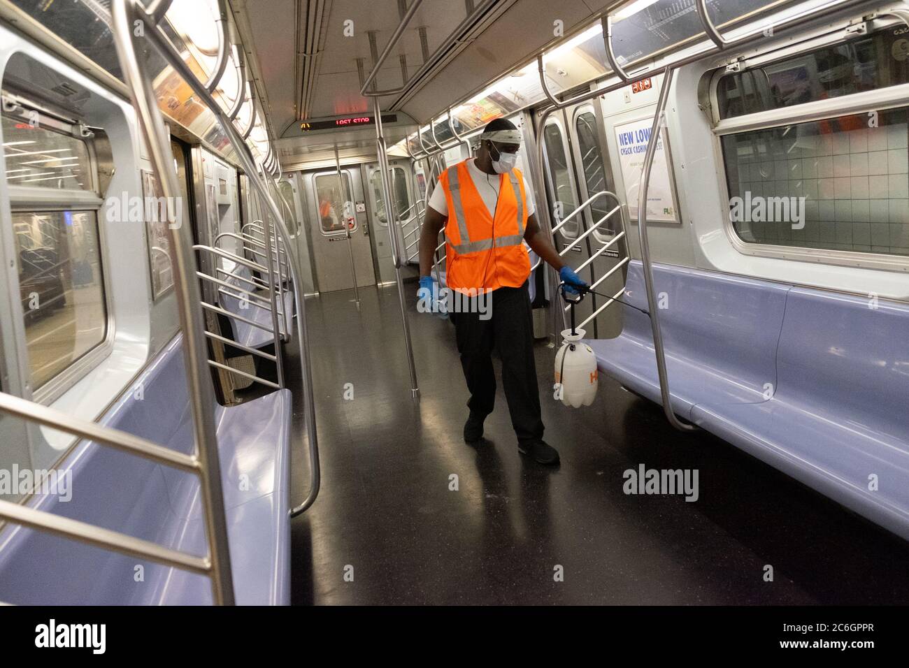 New York, United States. 08th July, 2020. A worker sprays a cleaning solution inside a subway car in Manhattan as the city enters phase 3 of reopening amid the coronavirus pandemic.As New York City enters phase 3 of reopening retail stores for indoor shopping, restaurants have been postponed for indoor dinning. Meanwhile Black Lives Matter protests continue in the city as the Mayor along with a group of people painted a large Black Lives Matter mural in front of Trump Tower on 5th Ave. Credit: SOPA Images Limited/Alamy Live News Stock Photo