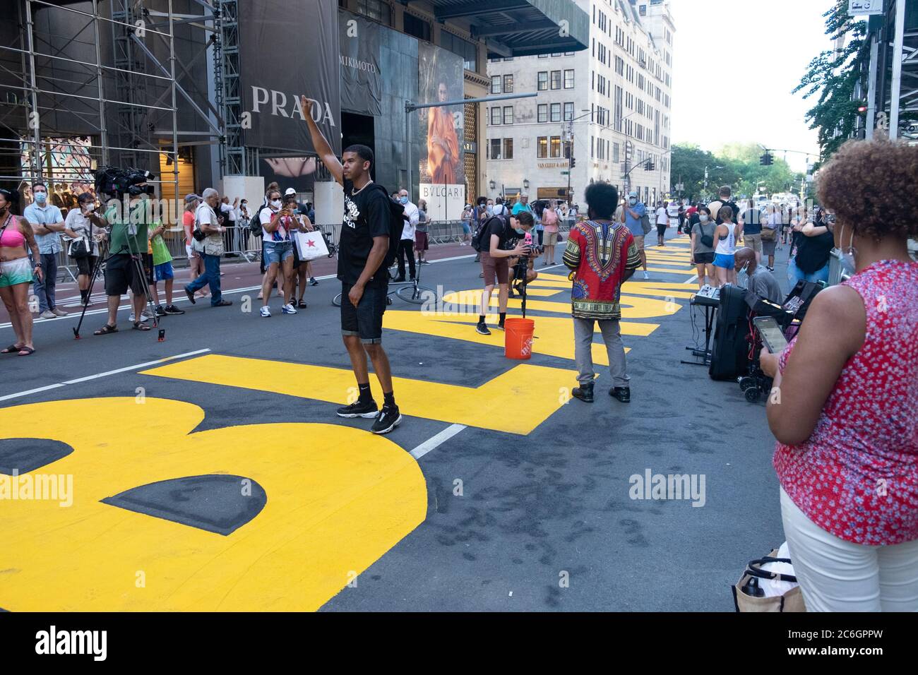 New York, United States. 08th July, 2020. Protesters taking pictures on a Black Lives Matter mural that was painted on the street in front of Trump Tower in Manhattan.As New York City enters phase 3 of reopening retail stores for indoor shopping, restaurants have been postponed for indoor dinning. Meanwhile Black Lives Matter protests continue in the city as the Mayor along with a group of people painted a large Black Lives Matter mural in front of Trump Tower on 5th Ave. Credit: SOPA Images Limited/Alamy Live News Stock Photo