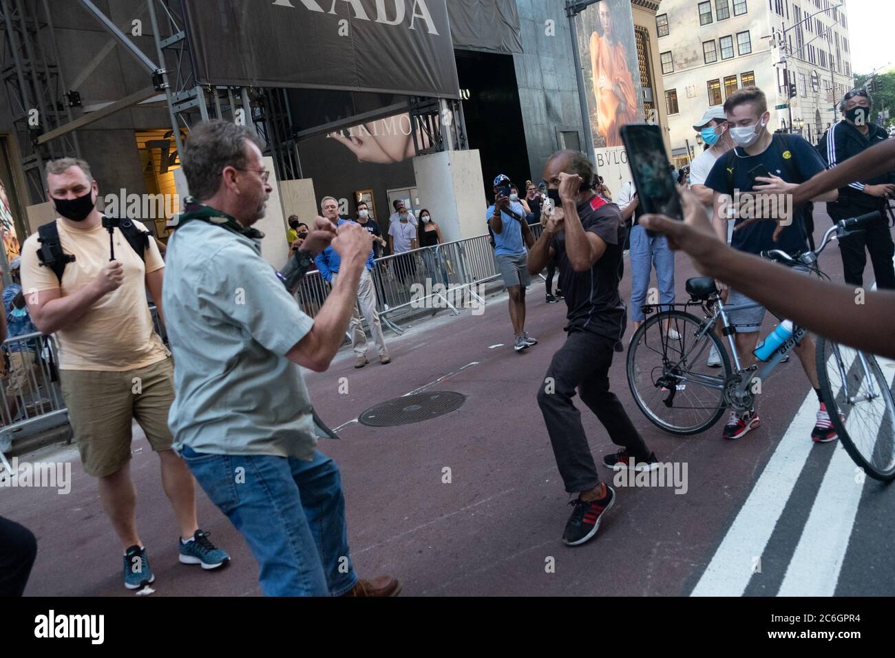 New York, United States. 08th July, 2020. A physical altercation between a Trump supporter and a BLM protester in front of Trump Tower in Manhattan where a large Black Lives Matter mural was painted.As New York City enters phase 3 of reopening retail stores for indoor shopping, restaurants have been postponed for indoor dinning. Meanwhile Black Lives Matter protests continue in the city as the Mayor along with a group of people painted a large Black Lives Matter mural in front of Trump Tower on 5th Ave. Credit: SOPA Images Limited/Alamy Live News Stock Photo