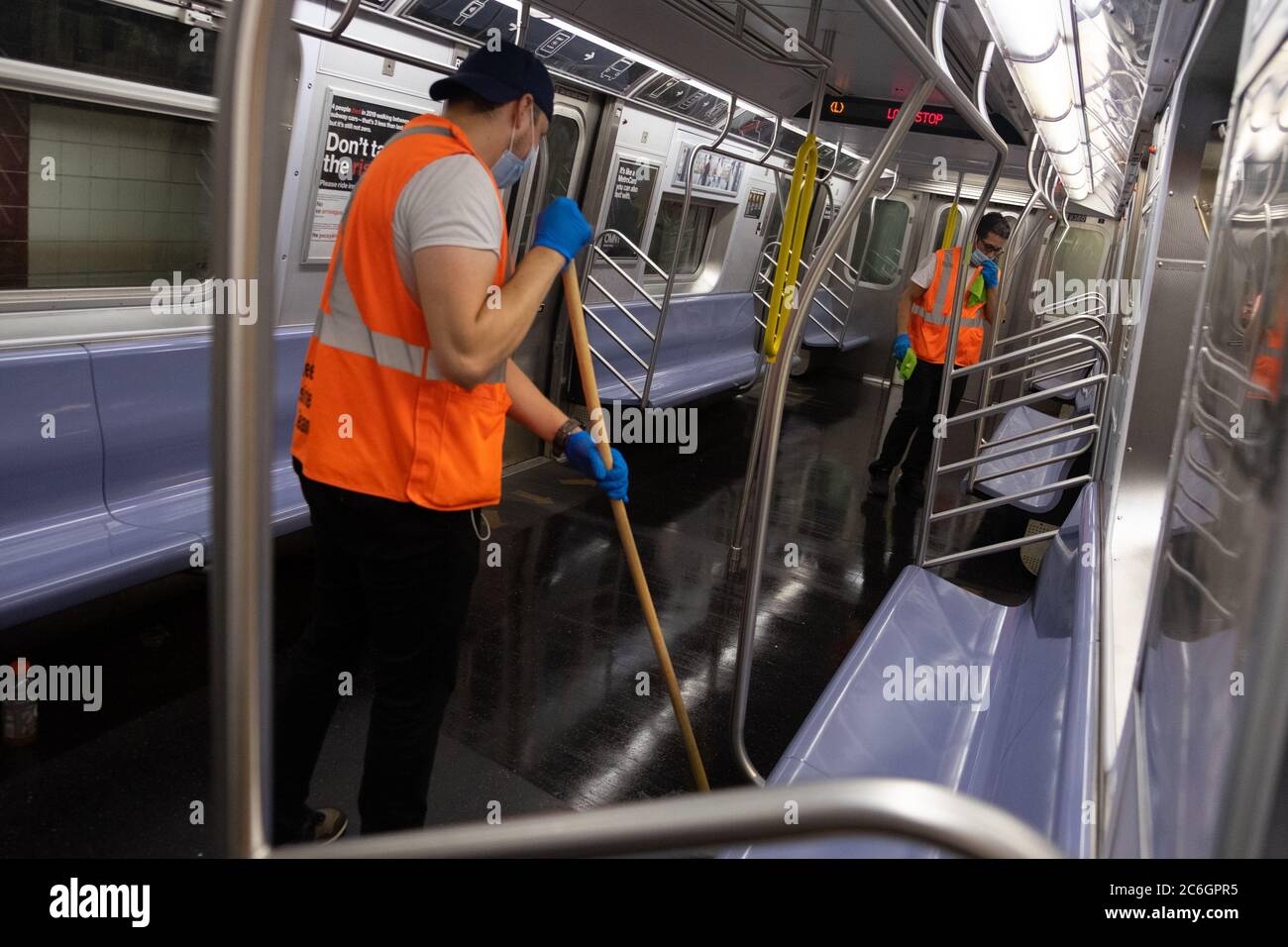 New York, United States. 08th July, 2020. Workers clean inside a subway car in Manhattan as the city enters phase 3 of reopening amid the coronavirus pandemic.As New York City enters phase 3 of reopening retail stores for indoor shopping, restaurants have been postponed for indoor dinning. Meanwhile Black Lives Matter protests continue in the city as the Mayor along with a group of people painted a large Black Lives Matter mural in front of Trump Tower on 5th Ave. Credit: SOPA Images Limited/Alamy Live News Stock Photo
