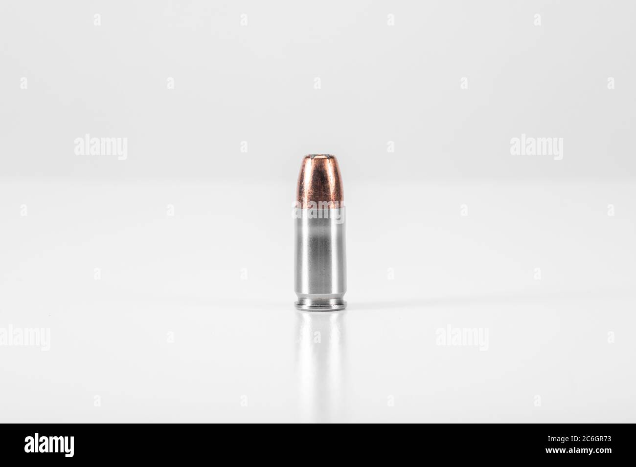9mm Round of Ammunition on White Background Stock Photo