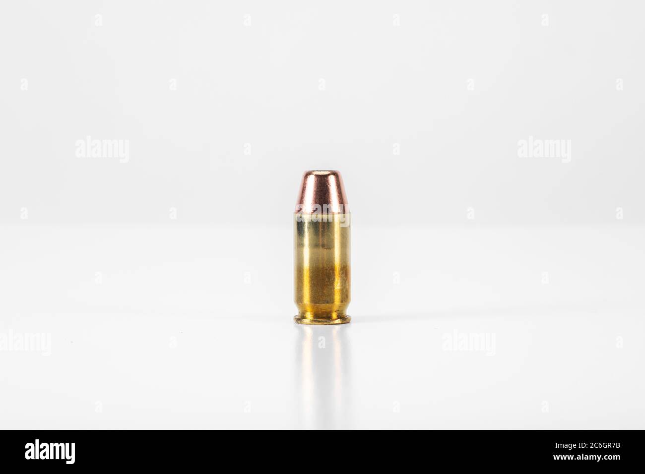 .45 Caliber Round of Ammunition on White Background Stock Photo