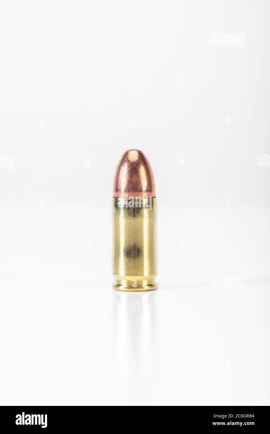 9mm Round of Ammunition on White Background Stock Photo