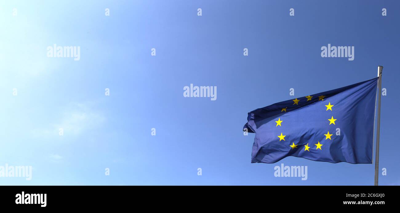 Flag of the European Union in front of a blue blue sky Stock Photo