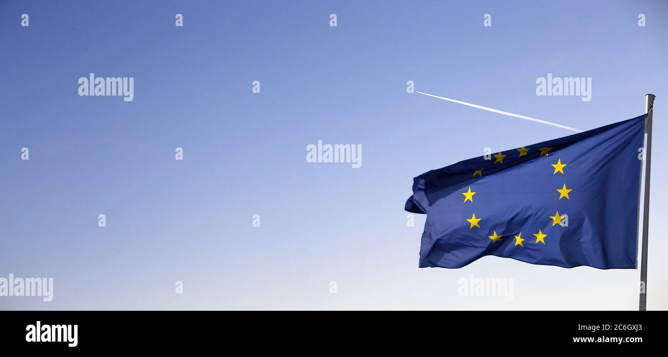 Flag of the European Union in front of a blue blue sky Stock Photo