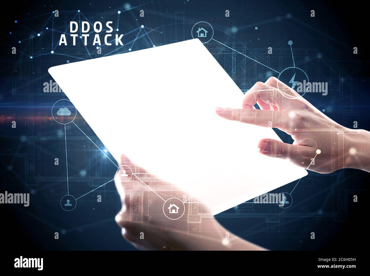 Holding futuristic tablet with DDOS ATTACK inscription, cyber security ...