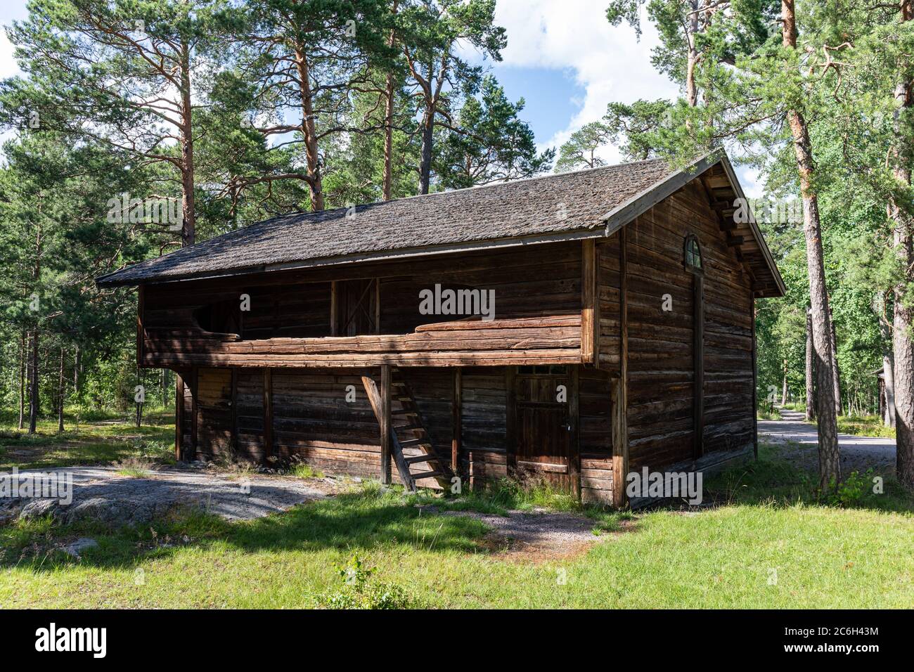 Old log loft storehouse in Seurasaari Open-Air Museum in Helsinki, Finland Stock Photo