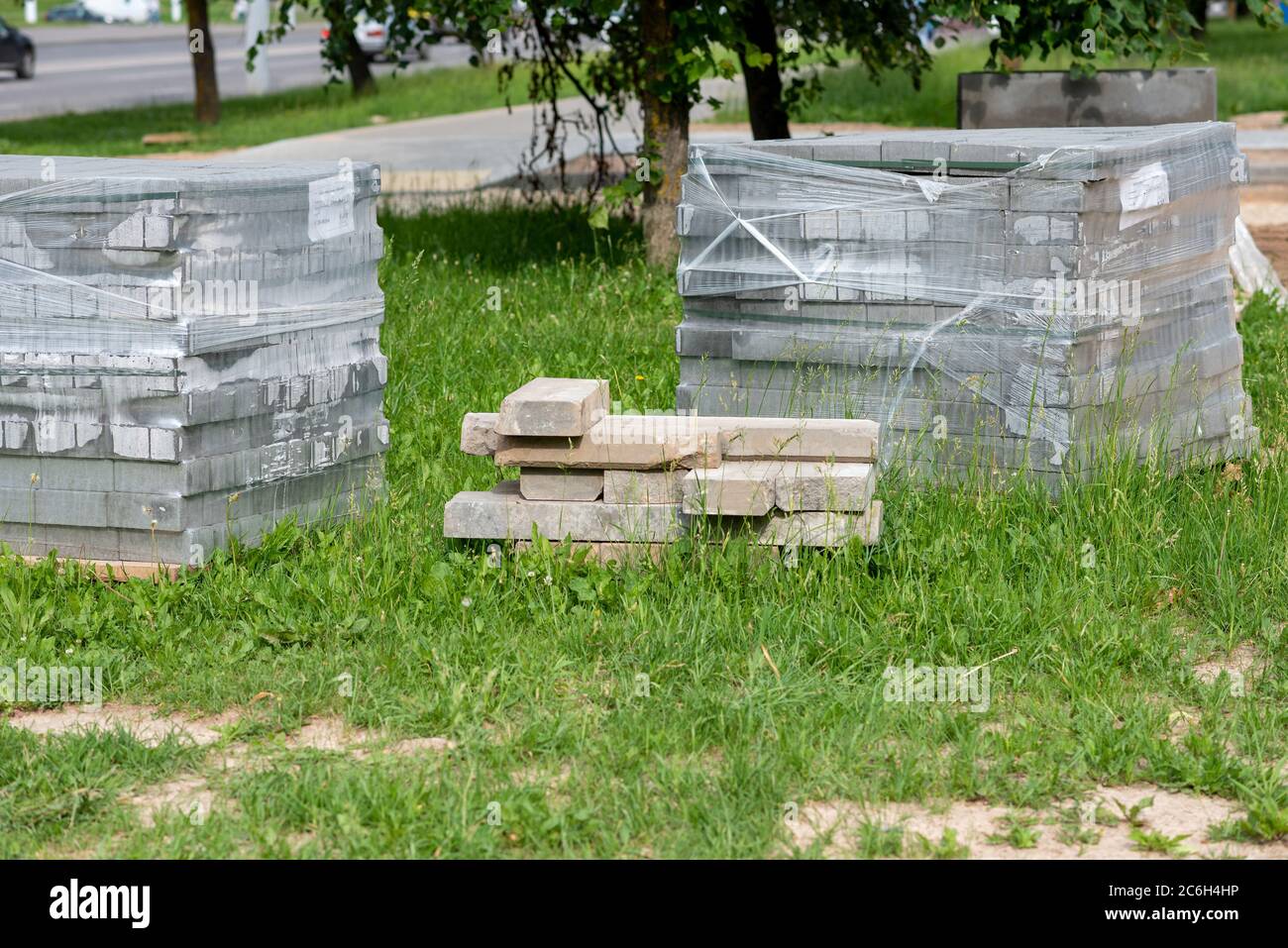Tile for sidewalks on a pallet in the street Stock Photo - Alamy
