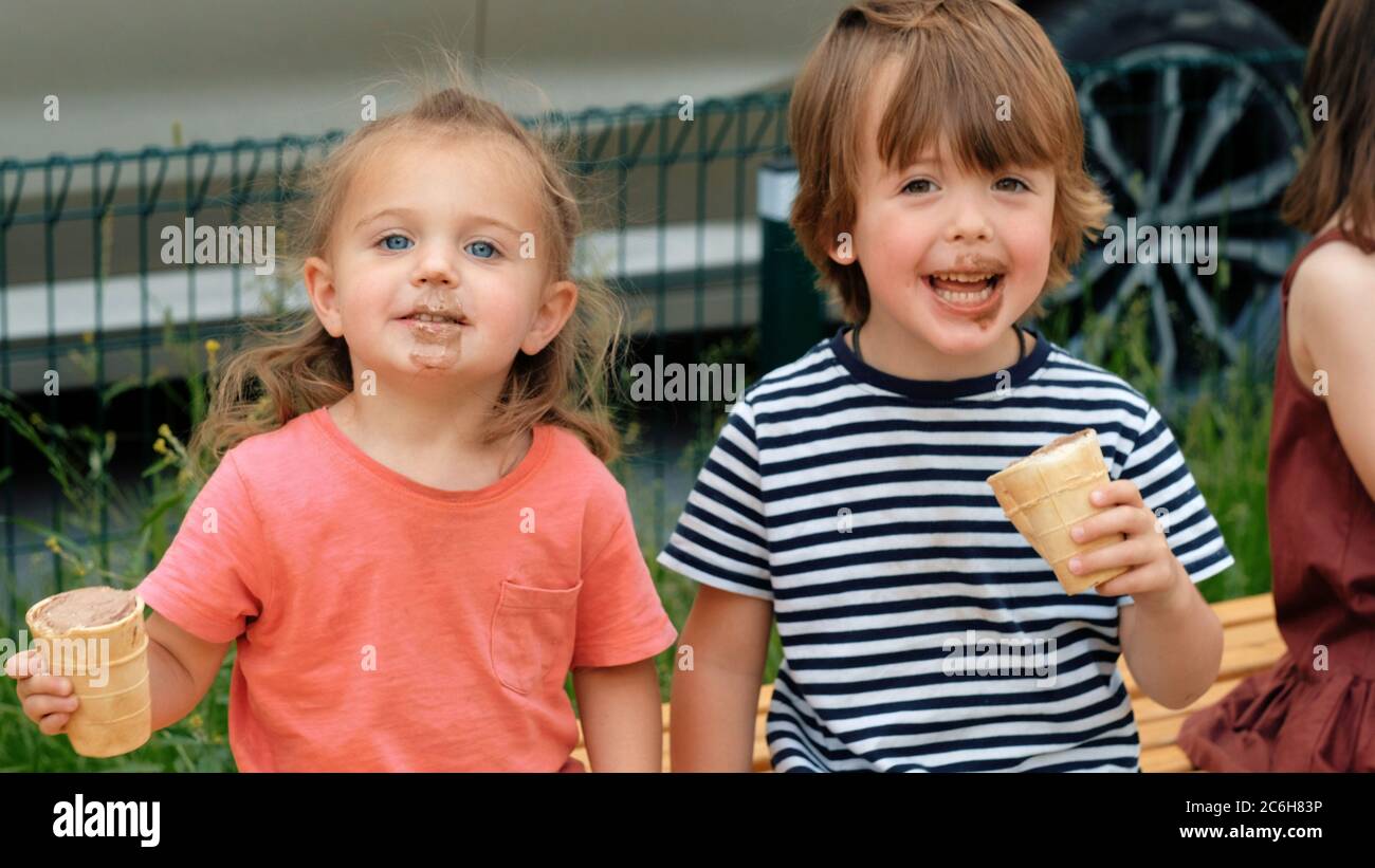 Two children eat ice cream Stock Photo