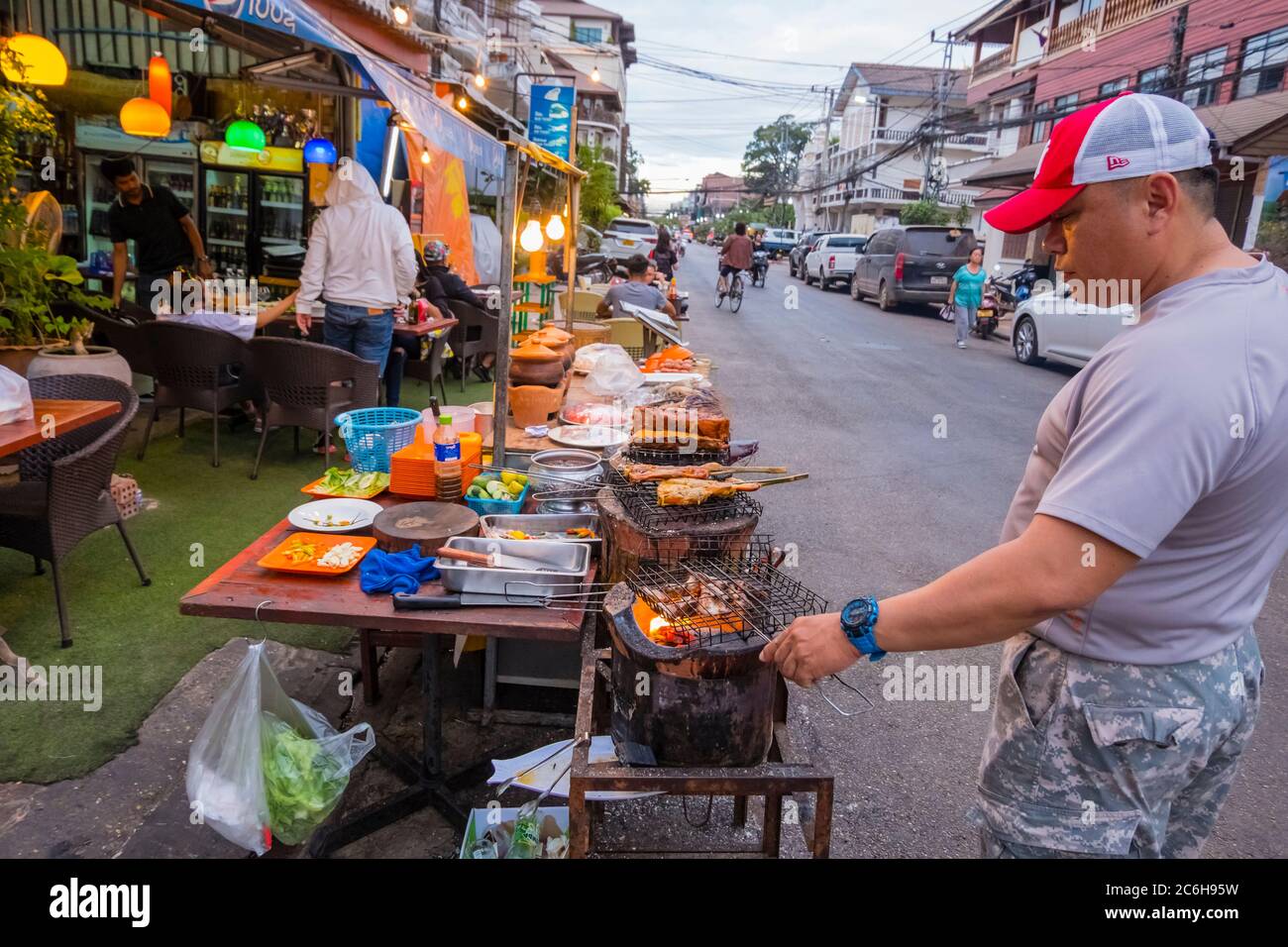 Grilling of fish and meat, Chao Anou Road, central Vientiane, Laos Stock Photo